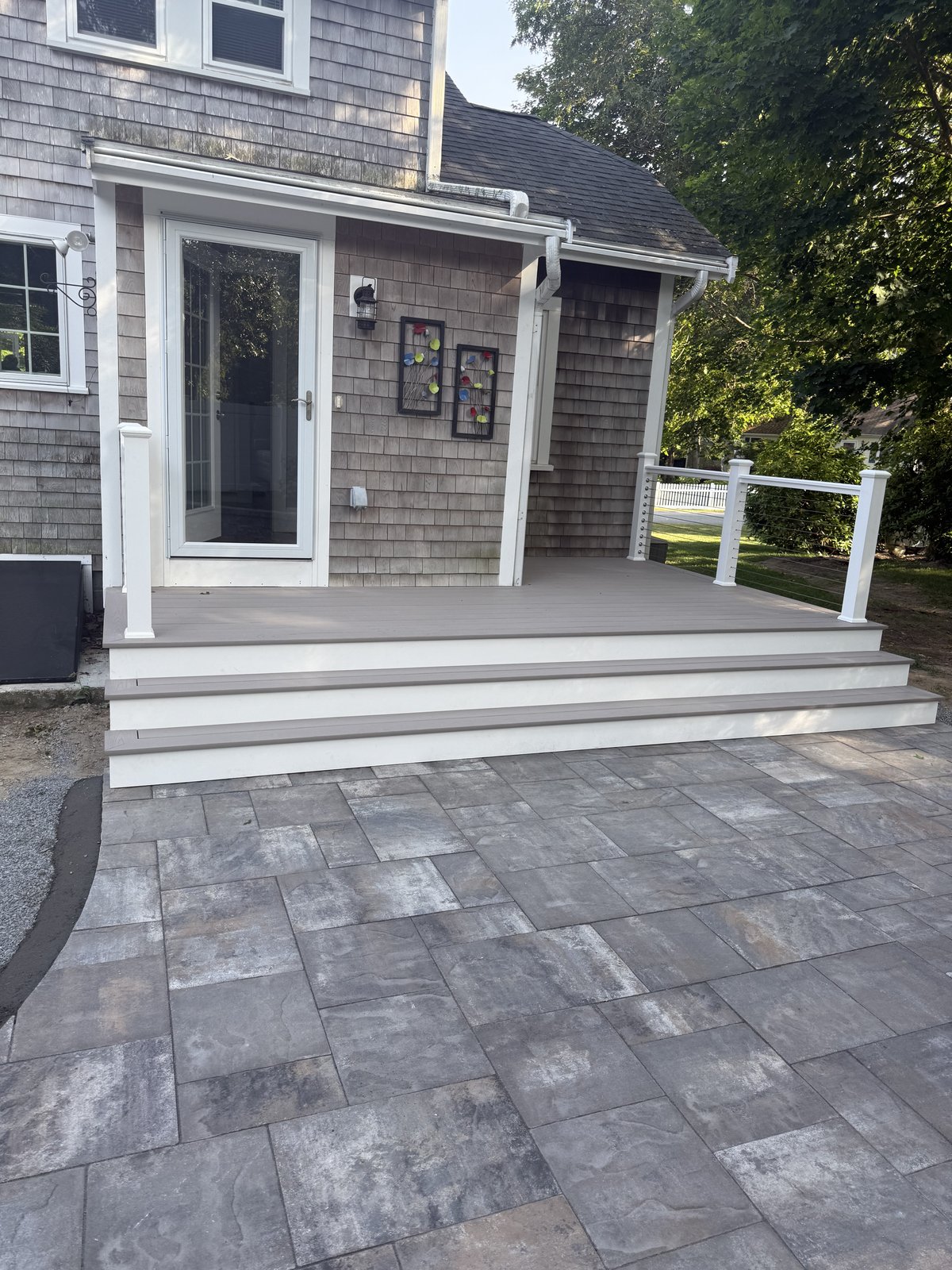 Composite deck and stairs with bluestone paver patio landing — Perocchi Building & Remodeling, Cape Cod MA