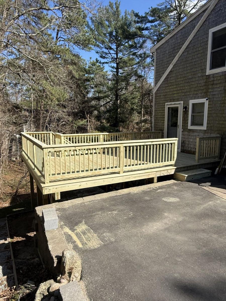 Custom raised pressure-treated deck with full railings — Perocchi Building & Remodeling deck builder, South Shore MA